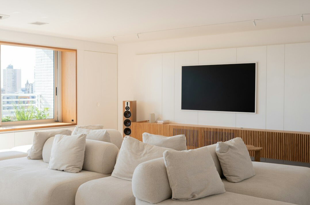 Television in a modern living room showing a streaming screen
